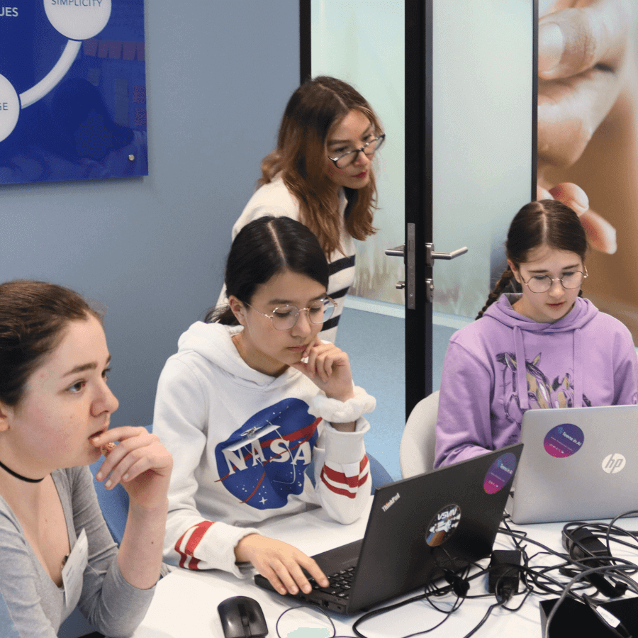 Elena Sinel mentoring young people during a hackathon